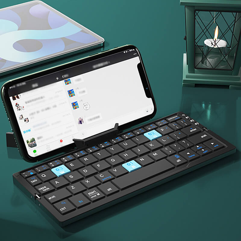 🌞Fris De Lente In Met 50% Korting!🎹 Opvouwbaar Mini Bluetooth-toetsenbord – Magnetische standaard, universeel compatibel & lange batterijduur, draagbaar voor telefoon/tablet/laptop